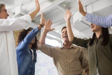 people-smiling-while-conference-rom